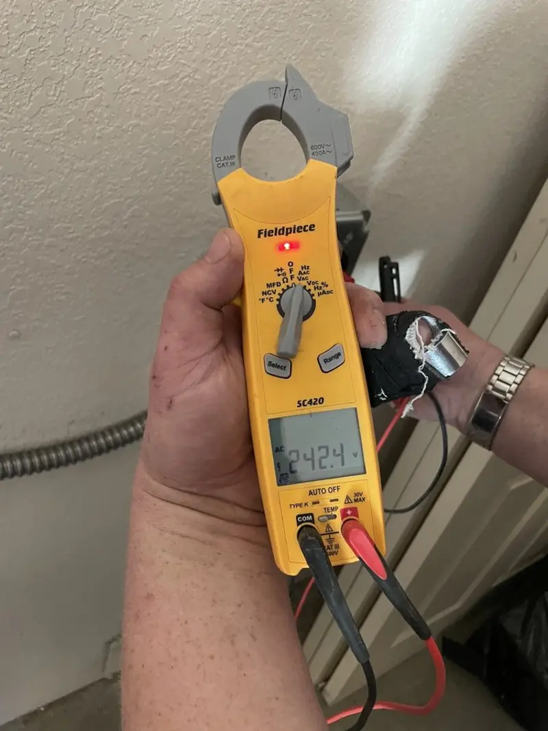 Voltage testing with clamp meter during Electrical Installation Services in Springfield